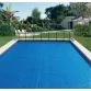 AstralPool 500 micron GeoBubble dark blue/gold pool solar cover, freeform, no border Photo №2